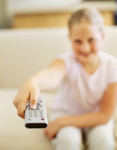 girl holding a remote control